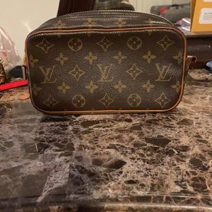 A small Louis Vuitton handbag